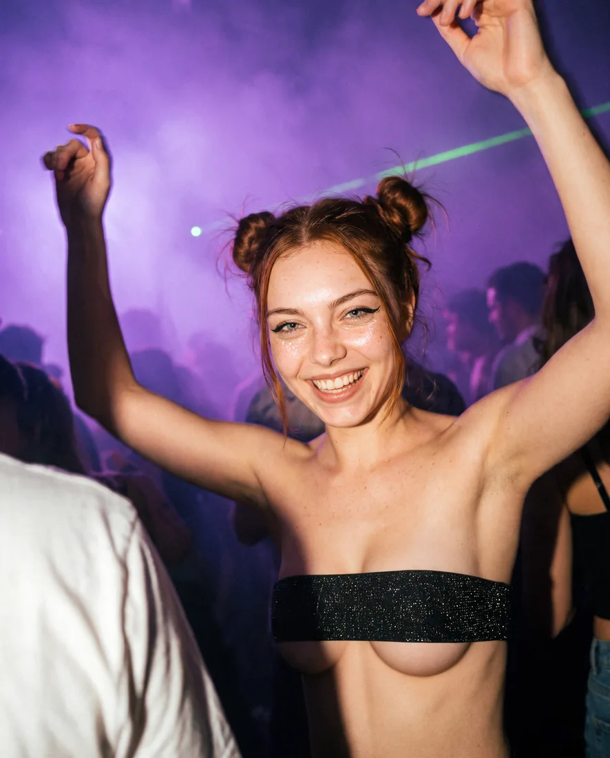 Roxie at an intimate techno club in Barcelona bathed in violet ambient lighting.